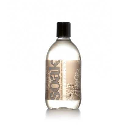 Bottle of Soak Lacey regular size laundry detergent on a white background