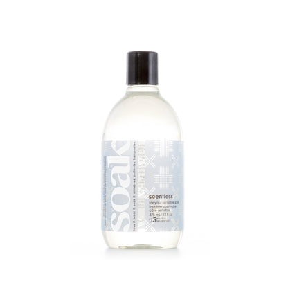 Bottle of Soak Scentless laundry detergent on a white background
