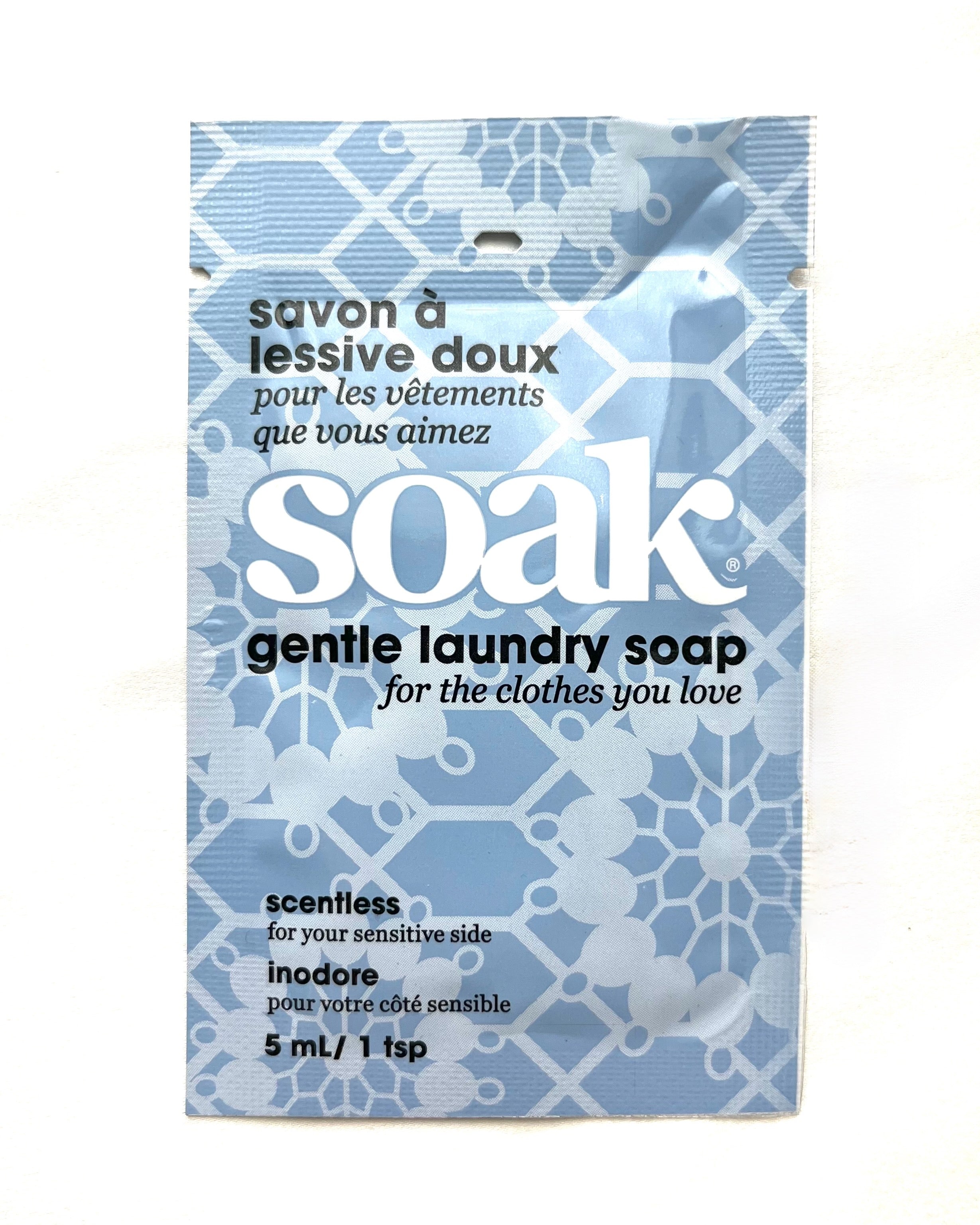 SOAK gentle laundry soap packet with blue and white design